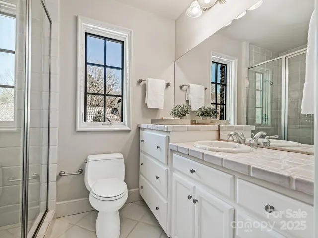 Apartment bath, stairs leading to exterior door by garage.  Washer and Dryer hook ups in garage for the apartment