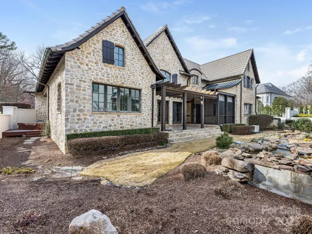 Bermuda grass, coy pond with waterfalls, generator, are a few of the custom items this home has waiting for you.