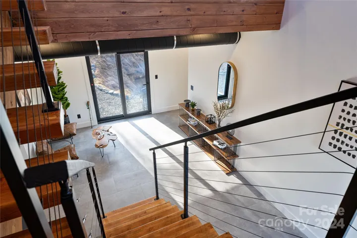 Stairway leading from the 3rd floor main living area to the second level.