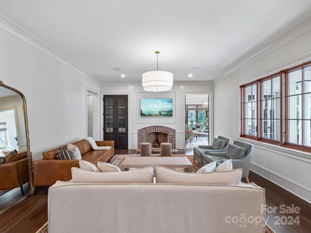 Great room has lots of seating and true woodburning fireplace.