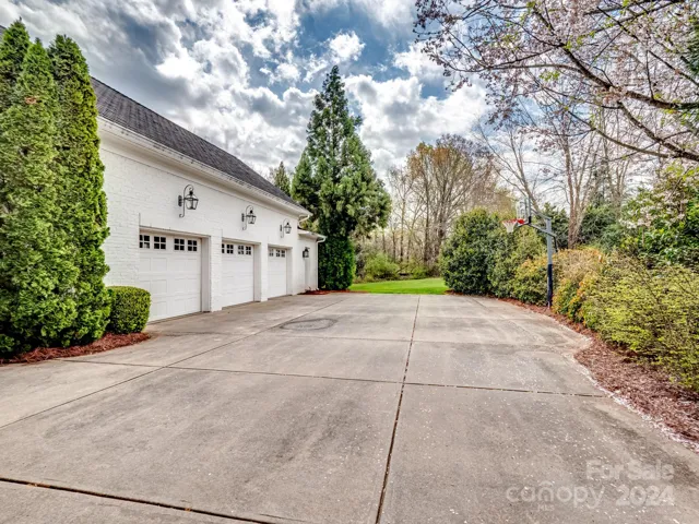 Large driveway and oversized garage area.  The driveway space is perfect for a pickleball court.  The seller has the rolling net for this space as well.