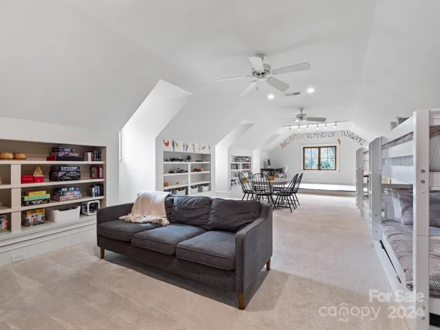 Huge bonus room over oversized garage is so fantastic with builtins and lots of light