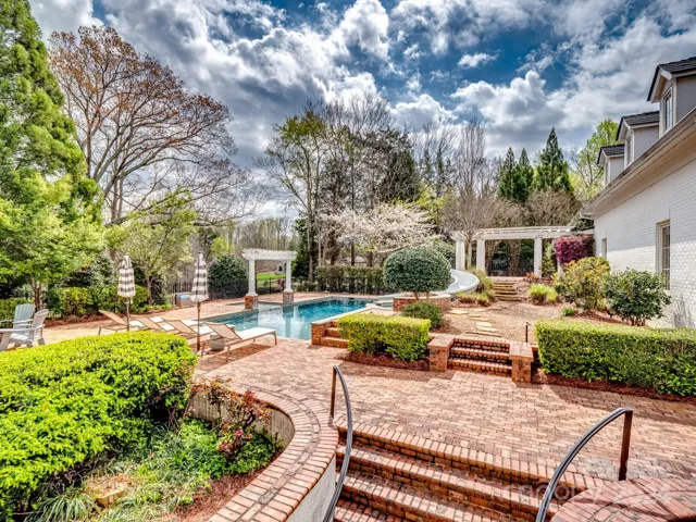 Wow!  This pool area is the most amazing space including spa spillover and rain curtain with covered terrace overlooking