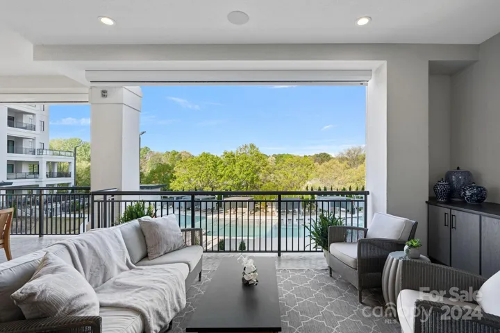 Stunning views of the resort style pool with tree lined canopy beyond