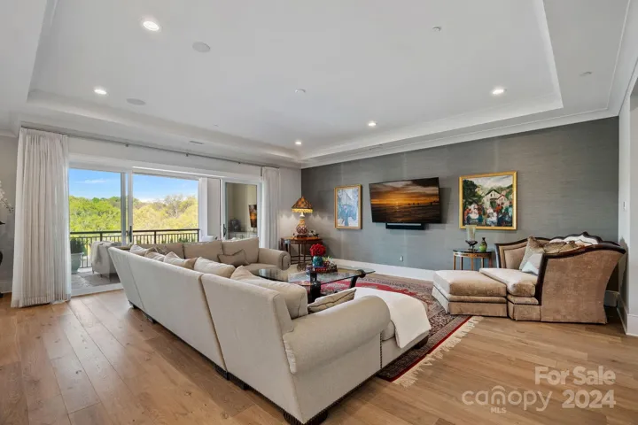 Large Living Room with Open floor plan.  Wide plank wood flooring throughout.