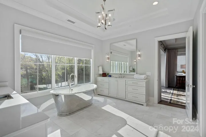 Bathroom built ins provide abundant storage, smart lighting sets the mood