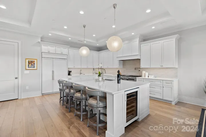 Kitchen Island with tons of storage, plus SubZ 2-zone temp wine fridge.  Your chef will appreciate Wolf 48" gas stove with double ovens, griddle and pot filler.