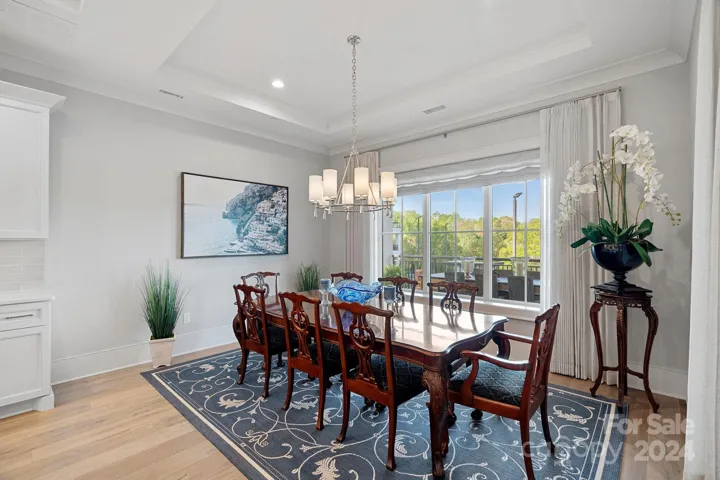 Plenty of room for wining or dining.  Window features drapes, roman shade, and Lutron automated blackout shade as well.