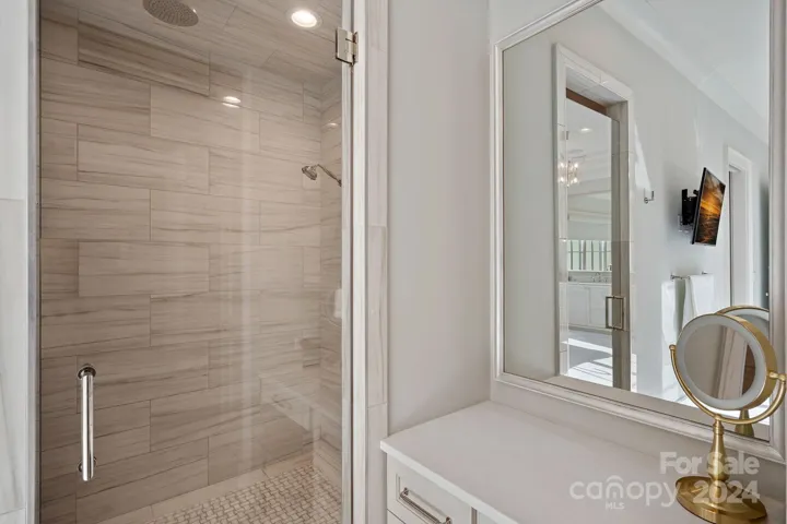 Primary Shower is zero entry with dual shower heads & bench.  Water closet features Toto Washlet.