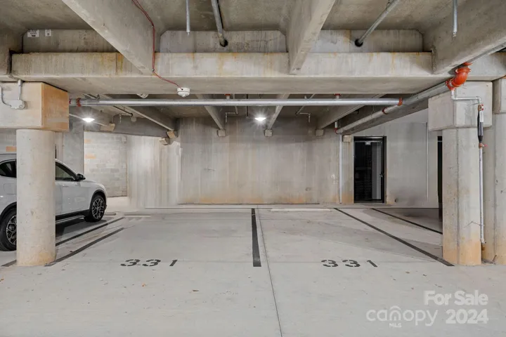 2 deeded parking spaces, and add'l private storage space in garage area