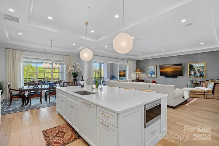 Easy flow from kitchen to living to dining.  Kitchen also has walk in pantry, and 2 paneled Sub Zero refrigerator drawers, plus prep sink.