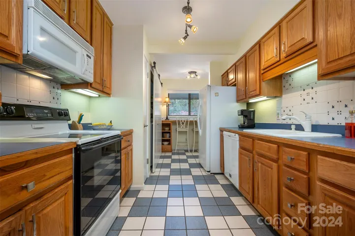 Kitchen with view of breakfast or office area