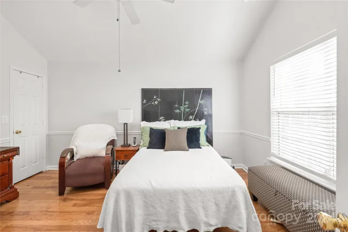 Primary bedroom is tucked away in the back on the MAIN floor facing the private backyard.