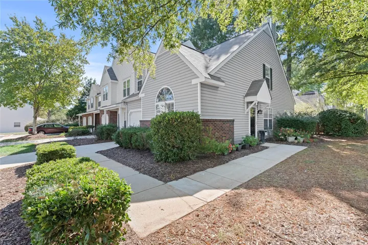 A spacious corner lot with side entrance provides privacy. Additional guest parking conveniently across the street.