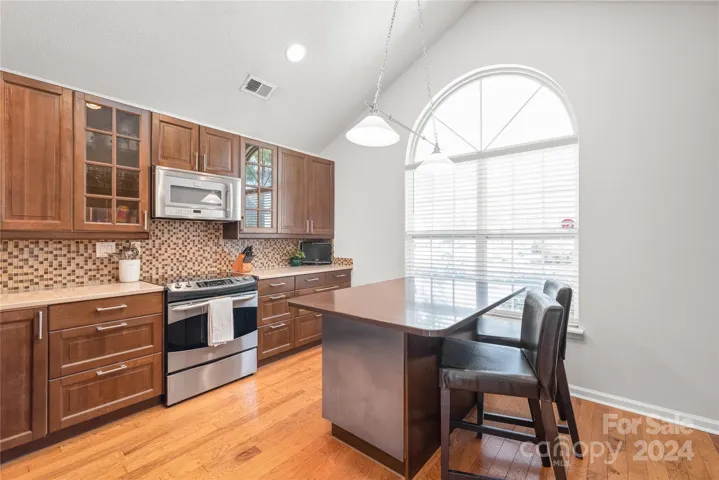 Convenient pull out drawers for pots and pans, large kitchen island and beautiful window for natural light.