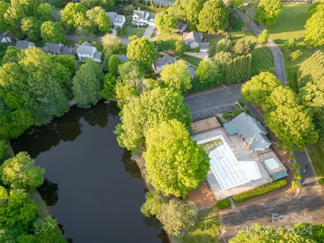 House is located above pond and pool