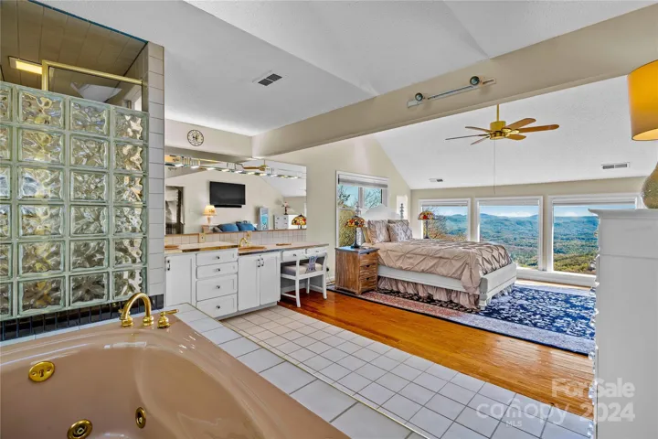 Primary suite on the upper-level w/majestic mountain views that fill the windows