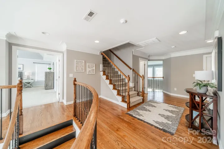 2nd Floor Landing with French Doors Leading to the Primary Bedroom