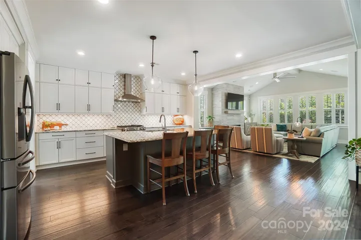 The open floor plan enhances the flow and spaciousness of the home, allowing for seamless interaction between the living, dining, and kitchen areas, ideal for hosting gatherings or simply enjoying daily activities.