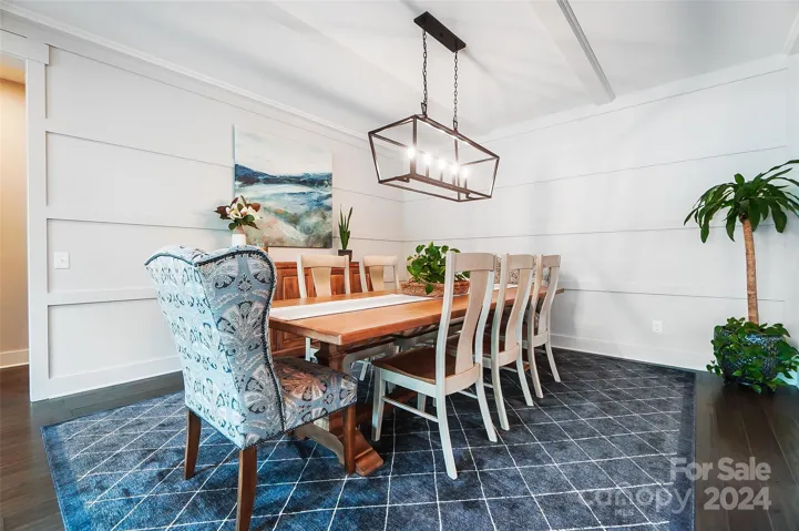 This designated space offers a refined atmosphere, complementing the open floor plan and enhancing the home's entertaining potential.