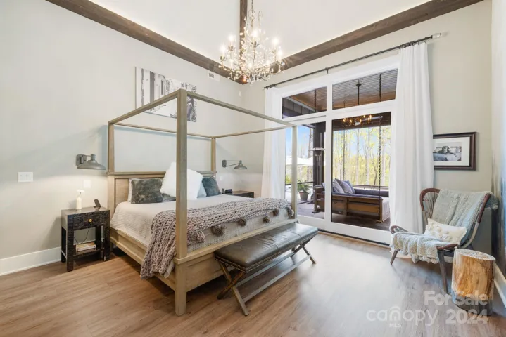 Primary Bedroom with Cathedral Ceiling with Wood Beans