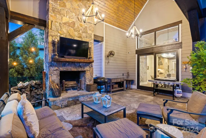 Covered Porch with Vaulted Ceiling & Wood Burning Fireplace
