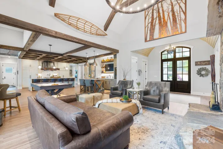 Open Family Room Overlooking Pool Table and Custom Bar