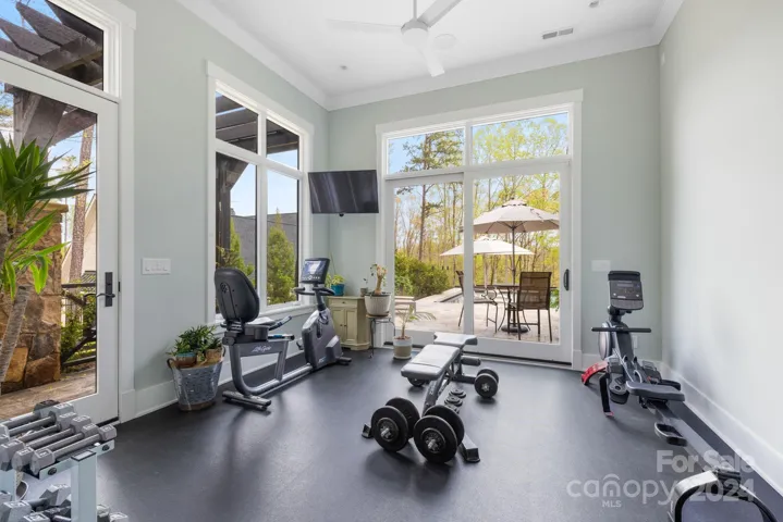 Home Gym off Primary Suite with Access to Outdoor Shower
