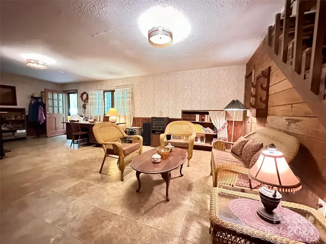 Basement level den or bonus office space or potential workout room