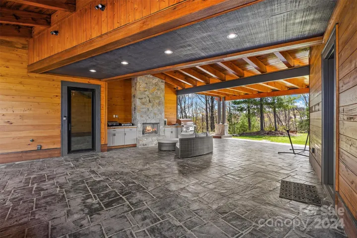 Breezeway with Fireplace and Kitchen