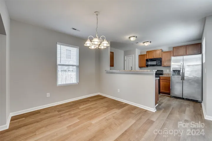 Dining & Kitchen with raised bar for additional seating.
