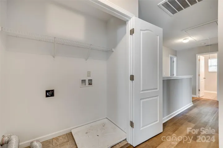 Laundry closet in upstairs hall.