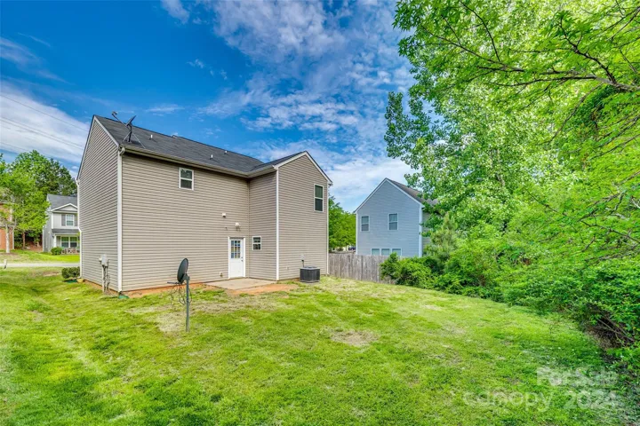 Spacious yard with patio & entrance to the Kitchen