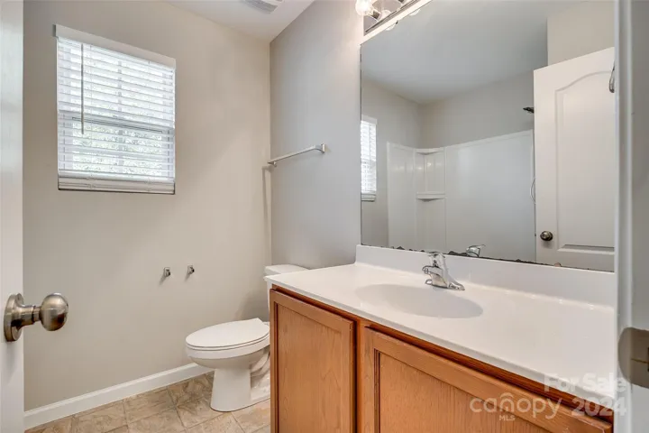 Upstairs hall bath with an operable window.
