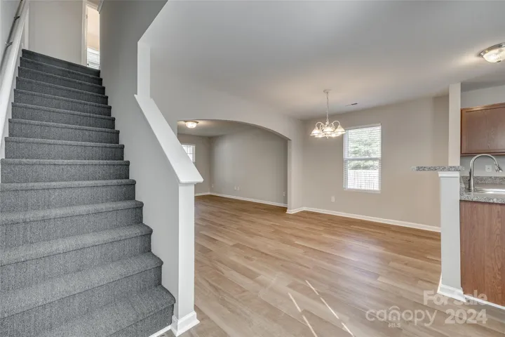 The staircase is at the back off the home!