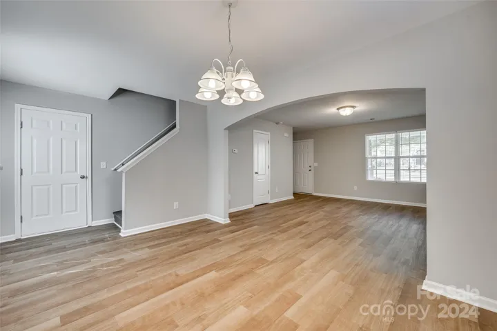 Arched opening between Great Room & Dining adds character.