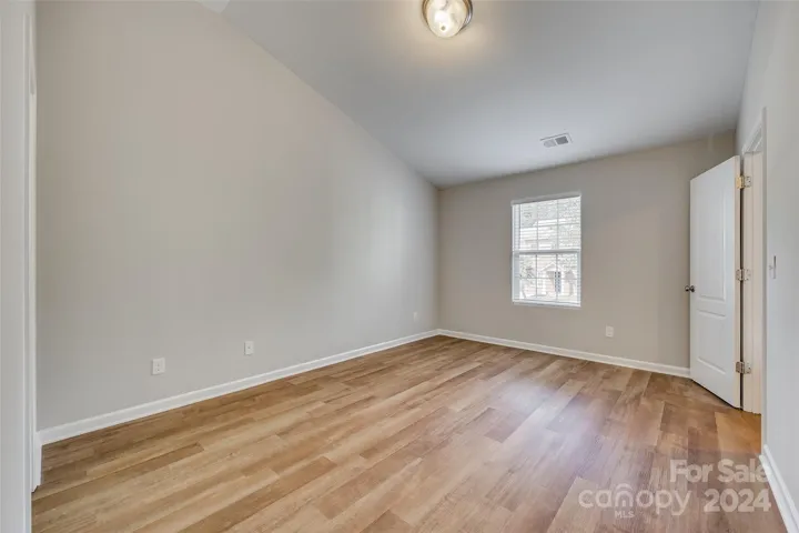 View of Primary Bedroom with door to hall on the right.