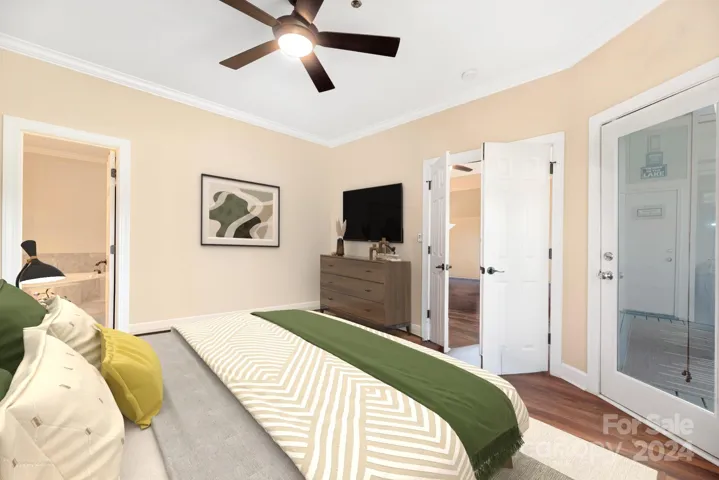 Primary bedroom (virtually staged) with ceiling fan