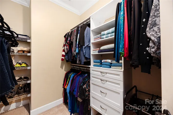 Custom closet system in primary bedroom