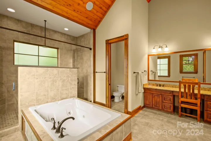 Primary suite bath on main level - with walk-in closets!