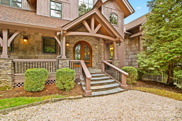 covered entry with bark and stone accents!
