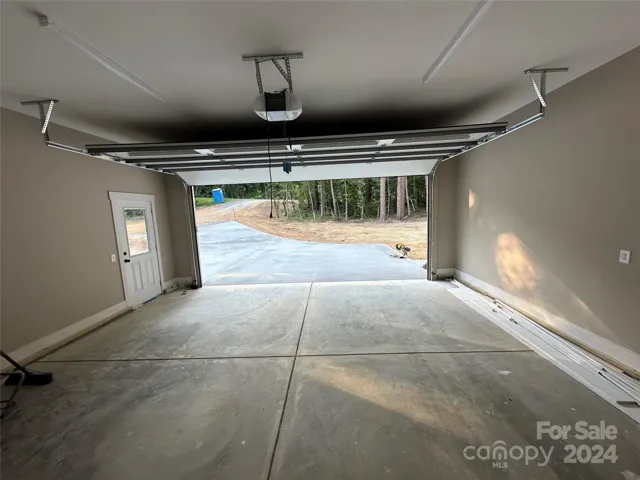 Finished 2 car garage with door opener & side service door