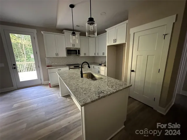 Custom Kitchen with Granite, 42” staggered & crown cabinetry + Pantry
