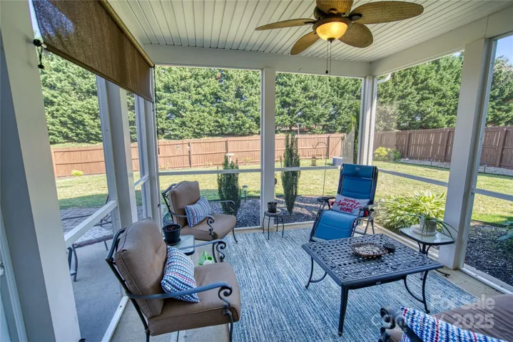 Enjoy relaxing or entertaining in your private fenced backyard with screen porch and patio.  Property extends behind the fence.
