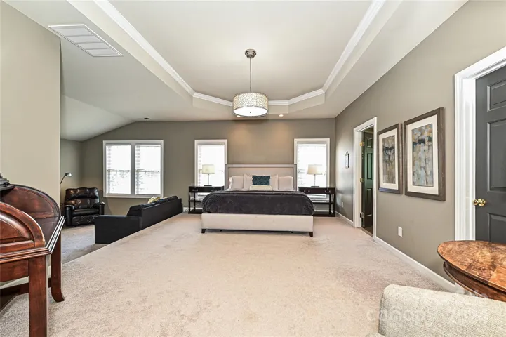 A spacious Primary Suite greets you with a Tray Ceiling and newly updated fixtures.
