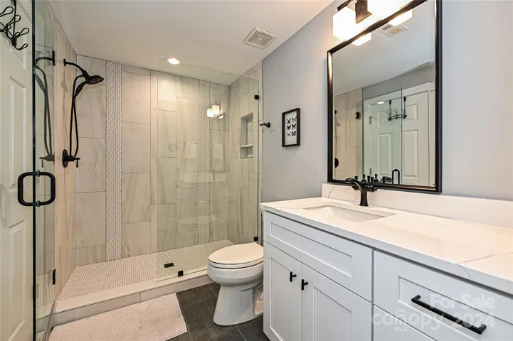 The Basement Bathroom is nicely done with stunning finishes.