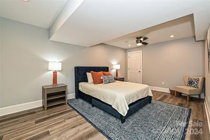 Bedroom 6 is located in the recently finished Basement, and features direct access to the Covered Rear Basement Patio
