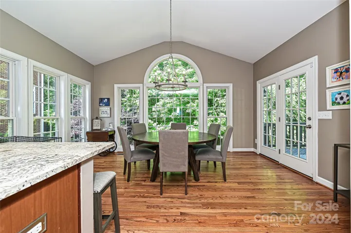 Surrounded by windows, this Sunroom brings the outdoors inside!