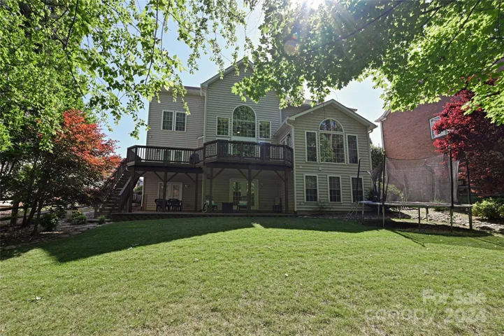 A spacious Rear Yard leads to acres of forest and a little-known 1.3 mile Mountain Biking/ Hiking Trail!