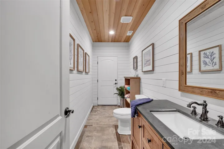 Half bath w/ door to exterior for easy pool access! How convenient!